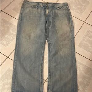 Light Blue Relaxed Fit Jeans with Faded Denim and Zipper Fly